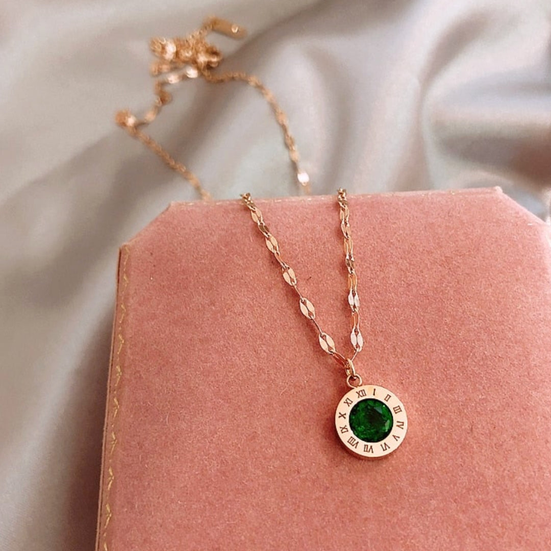 Gouden tijdsketting met smaragd