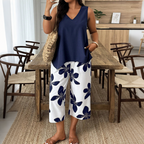 Set aus asymmetrischem Damenoberteil und Caprihose mit Blumenmuster – vielseitig, farbenfroh, bequem 🌺