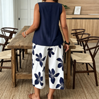 Set aus asymmetrischem Damenoberteil und Caprihose mit Blumenmuster – vielseitig, farbenfroh, bequem 🌺